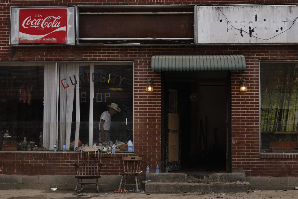 Charles Hawkins, 83, works to repair his shop helping as his family help to rebuild his shop on Friday, Aug. 5, 2022, in Fleming-Neon, Ky. Hawkins' antique shop was damaged in massive flooding, however they plan to rebuild. (AP Photo/Brynn Anderson)