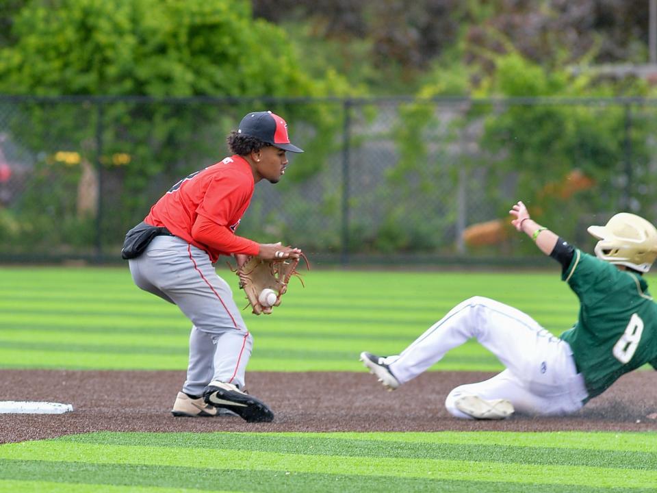 Durfee’s Jeyden Espinal fields a throw from catcher Joseph Silvia during last season’s playoff game against Lynn Classical.