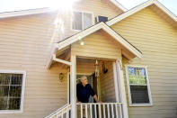 Carl Johnsen stands outside his Paradise, Calif., home, Thursday, Oct. 26, 2023. Facing a $14,702 quote to renew his homeowners insurance, Johnsen plans to let coverage lapse when it expires in November. (AP Photo/Noah Berger)