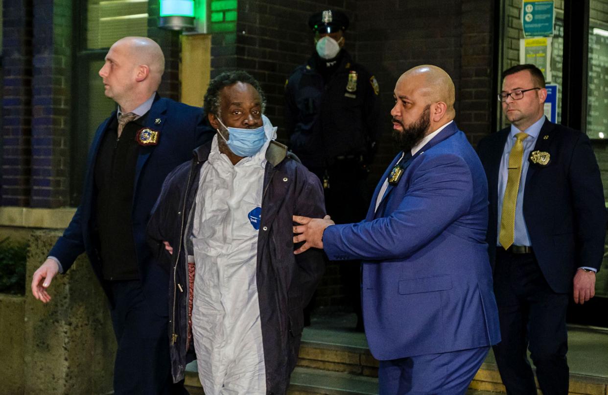 Simon Martial, charged with murder, is escorted by detectives from the Midtown South Precinct in Manhattan, New York on Saturday, Jan. 15, 2022. 