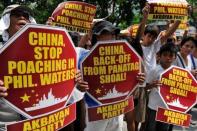 Activists are pictured during a protest in front of the Chinese Consular Office in Manila, on April 16, demanding the Chinese government to immediately pull out from Scarborough Shoal