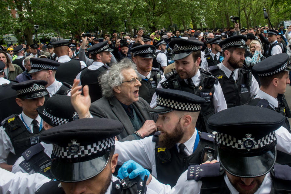 LONDON, ENGLAND - MAY 16: Piers Corbyn (brother of former Labour leader Jeremy Corbyn) is arrested as conspiracy theorists gather at Hyde Park Corner to defy the emergency legislation and protest their claim that the Coronavirus pandemic is part of a secret conspiracy on May 16, 2020 in London, United Kingdom. The prime minister has announced the general contours of a phased exit from the current lockdown, adopted nearly two months ago in an effort curb the spread of Covid-19. (Photo by Guy Smallman/Getty images)