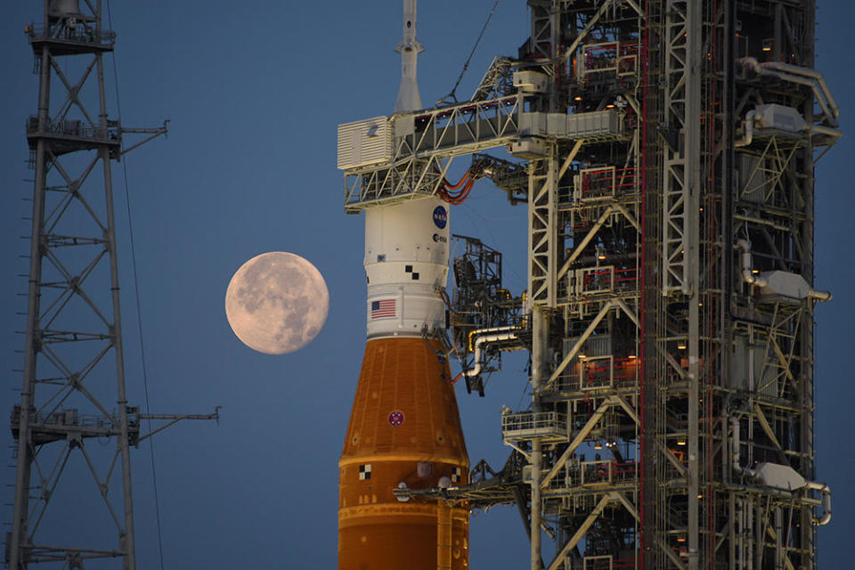 The SLS rocket and its target - the moon - as seen earlier this summer. NASA is working to ready the Space Launch System rocket for a trip back out to launch pad 39B around August 18, setting the stage for launch on an unpiloted maiden flight around August 29. / Credit: William Harwood/CBS News