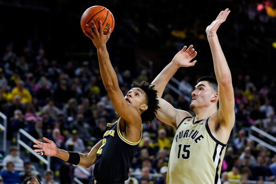 Michigan guard Kobe Bufkin (2) goes to the basket against Purdue center Zach Edey (15) during the first half at Crisler Center in Ann Arbor on Thursday, Jan. 26, 2023.