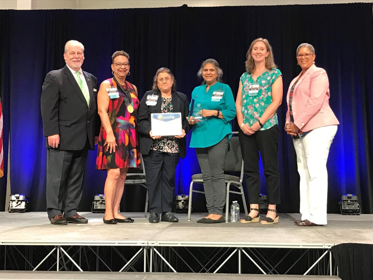 Representatives of Women Aware’s Domestic Violence Response Teams accept the Governor’s Volunteerism Award for First Responders.