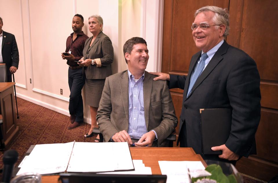 Mayor Cooper waits by At Large council member Bob Mendes' desk to be introduced to speak during the new council's first meeting at city hall on Tuesday, Oct. 1, 2019.