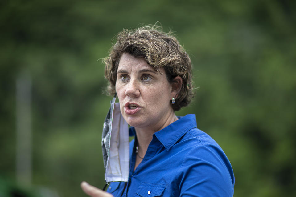 FILE - U.S. Senate candidate Amy McGrath speaks to members of the media during a visit to Thankful Hearts Food Pantry in Pikeville, Ky., in a Monday, June 22, 2020 file photo. Senate Majority Leader Mitch McConnell's prominent role in the federal response to the coronavirus pandemic has become Topic A in his bitter campaign against Democratic challenger Amy McGrath, providing fodder for both sides. (Ryan C. Hermens/Lexington Herald-Leader via AP, File)