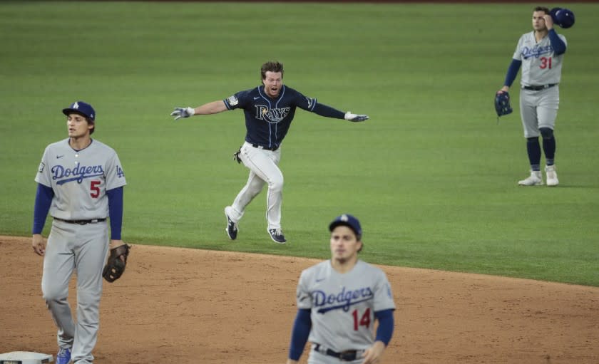 Brett Phillips dashes across the field after his game-winning hit against the Dodgers in Game 4 on Saturday.