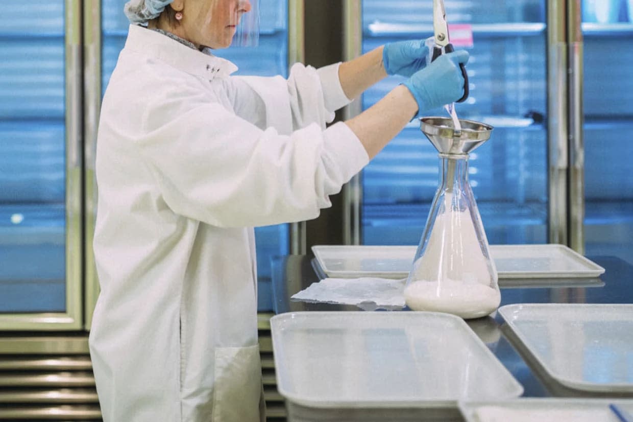 Milk is prepared for pasteurization at the Three Rivers Mothers' Milk Bank in Pittsburgh in 2017. (Andrew Rush / Pittsburgh Post-Gazette via AP)