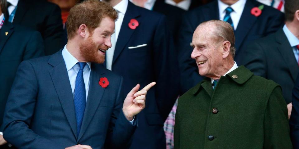 <p>Prince Phillip and Prince Harry share a laugh during the Rugby World Cup Final. </p>