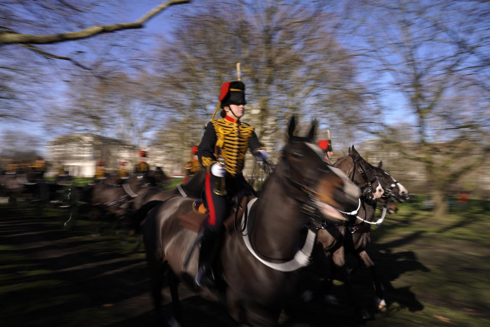 The King's Troop Royal Horse Artillery arrive at Green Park for fire gun salutes to mark the 70th anniversary of the accession to the throne of Britain's Queen Elizabeth, London, Monday, Feb. 7, 2022. Queen Elizabeth II acceded to the throne on the death of her father King George VI on Feb. 6, 1952.(AP Photo/Alberto Pezzali)