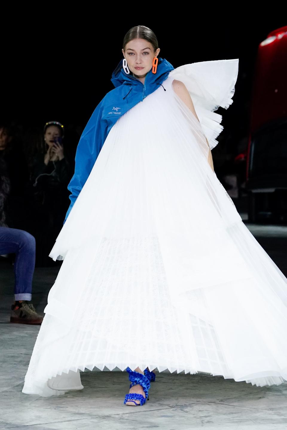 Gigi Hadid walking the runway in a tufted tulle gown.