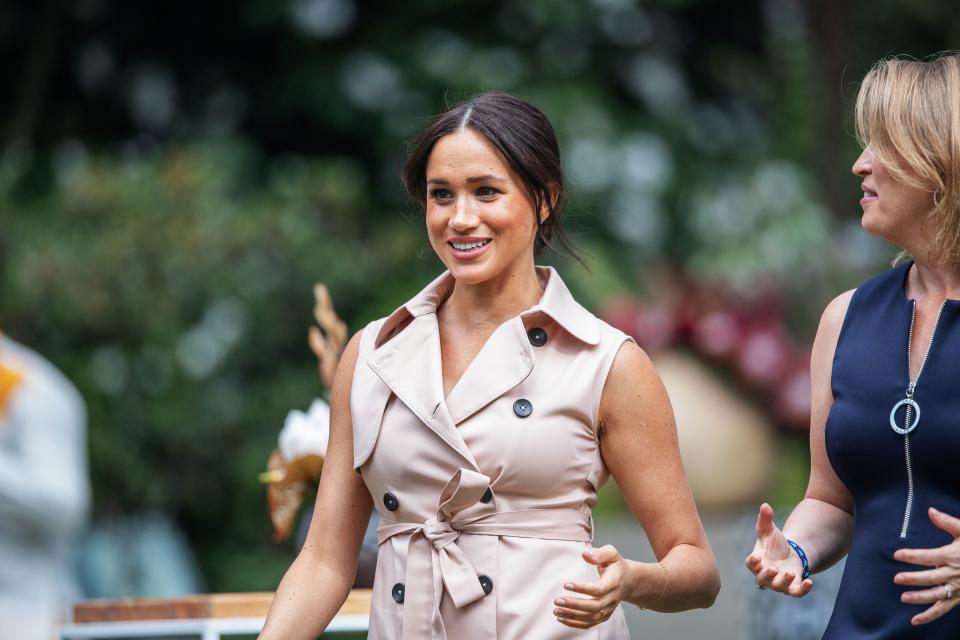 Meghan, the Duchess of Sussex(L) arrives at the British High Commissioner residency in Johannesburg where she  will meet with Graca Machel, widow of former South African president Nelson Mandela, in Johannesburg, on October 2, 2019. - Prince Harry recalled the hounding of his late mother Diana to denounce media treatment of his wife Meghan Markle, as the couple launched legal action against a British tabloid for invasion of privacy. (Photo by Michele Spatari / AFP) (Photo by MICHELE SPATARI/AFP via Getty Images)