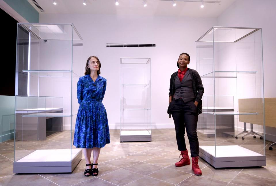 Christina Bevilacqua, left, programs and exhibitions director, and Janaya Kizzie, events and programs manager, in the new exhibition room at the Providence Public Library. The two are reshaping the way library programming is conceived and executed, making it more community-responsive, inclusive and dynamic.