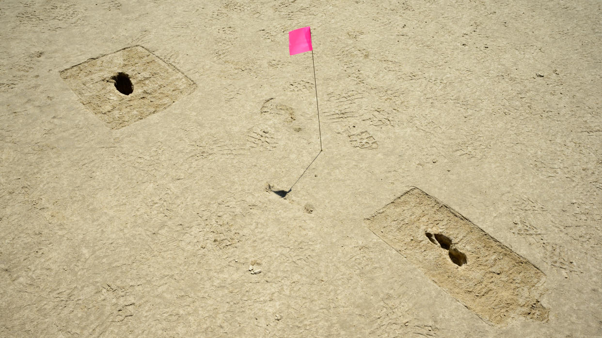 Footprints discovered on an archaeological site are marked with a pin flag on the Utah Test and Training Range (U.S. Air Force photo by R. Nial Bradshaw)