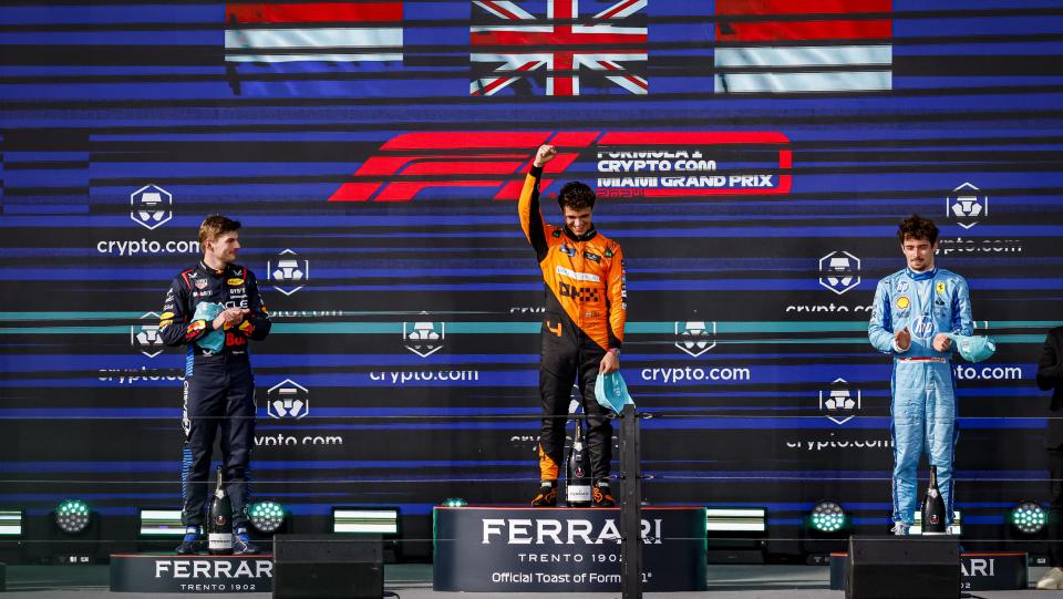 MIAMI, FLORIDA - MAY 5: Second-placed Red Bull Racing driver Max Verstappen of Netherlands, winner McLaren driver Lando Norris of Britain, and third-placed Scuderia Ferrari driver Charles Leclerc of Monaco celebrate on the podium after the 2024 Formula 1 Miami Grand Prix at Hard Rock Stadium on May 05, 2024, in Miami, Florida. (Photo by Eva Marie Uzcategui/Anadolu via Getty Images)