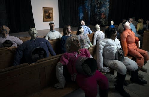 <span class="caption">A member of gallery staff sits in one of 2019's winning pieces called 'Collective Conscience' by artist Oscar Murillo.</span> <span class="attribution"><a class="link " href="https://webgate.epa.eu/webgate" rel="nofollow noopener" target="_blank" data-ylk="slk:Will Oliver/EPA;elm:context_link;itc:0;sec:content-canvas">Will Oliver/EPA</a></span>