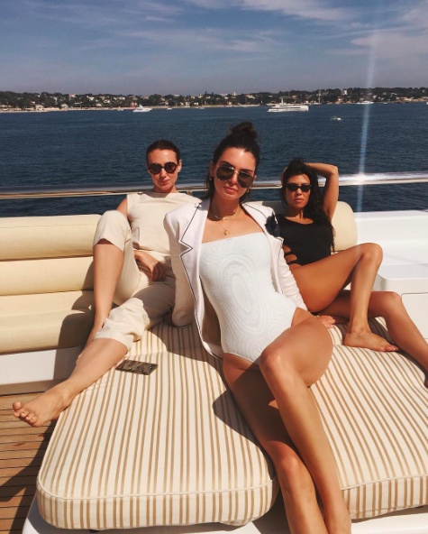 <p>”Meet us at the lido deck,” Kendall captioned a snap of herself, sister Kourtney, and a friend chilling in their bathing suits. Kendall sported a stunning white one-piece for the occasion, while Kourt donned a black suit with dramatic cut-out details. For some inexplicable reason, Kendall decided to put a suit jacket over her suit — but she’s a supermodel, so it kind of works. (Photo: Kendall Jenner via Instagram) </p>