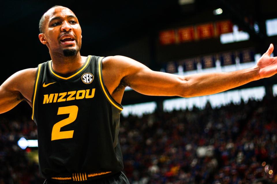 Missouri guard Tamar Bates argues with a foul call during a college basketball game against Kansas at the Allen Fieldhouse on Dec. 9, 2023, in Lawrence, Kan.