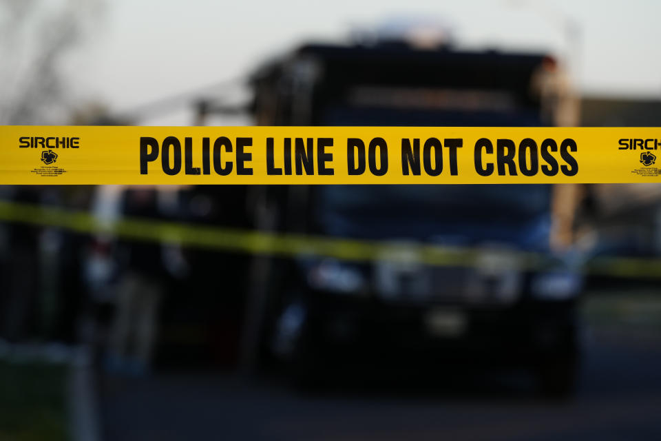 Police tape cordons off the scene of a fatal shooting in Levittown, Pa., Saturday, March 16, 2024. Police say a man suspected of killing multiple family members in the Philadelphia area has been arrested in New Jersey. (AP Photo/Matt Rourke)