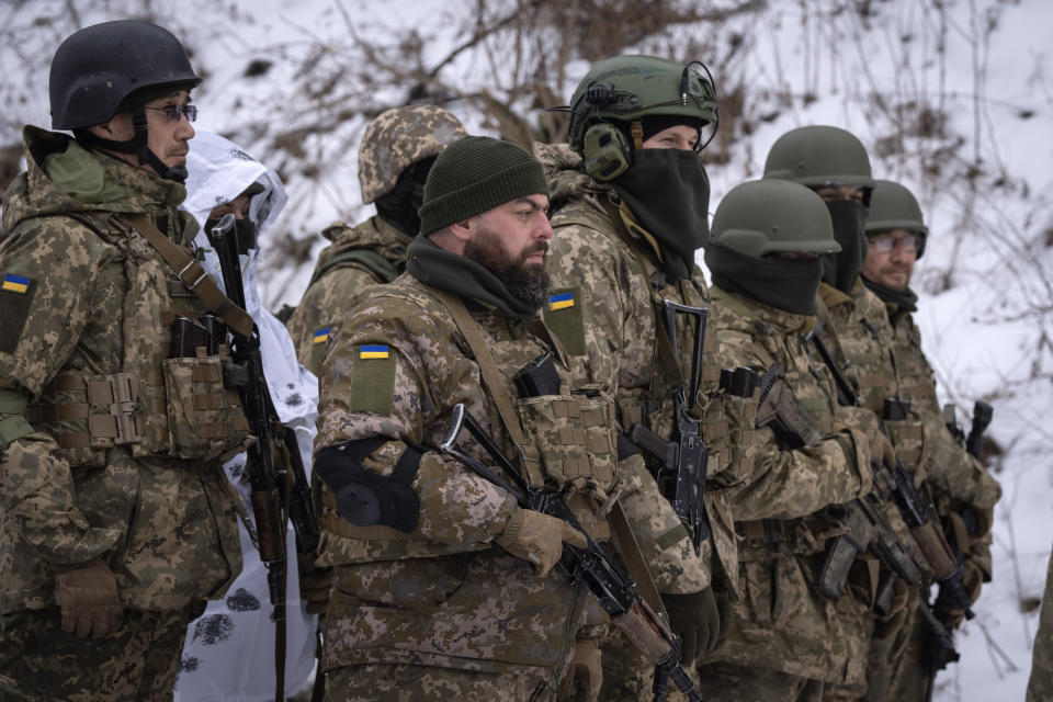 Members of the pro-Ukrainian Russian ethnic Siberian Battalion practice at a military training close to Kyiv, Ukraine, Wednesday, Dec. 13, 2023. Ukraine's military has formed a battalion of soldiers made up entirely of Russian citizens who want to fight against Russian invasion.(AP Photo/Efrem Lukatsky)