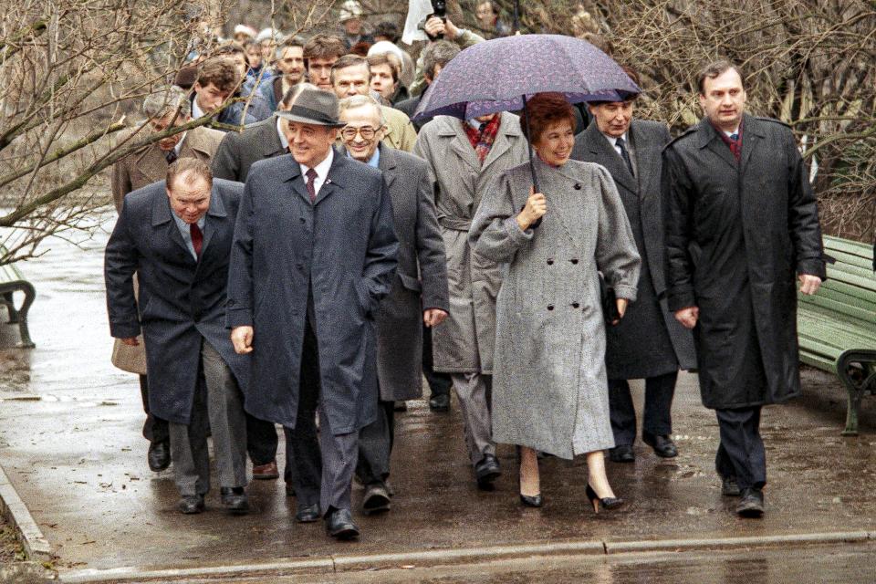 FILE - Soviet President Mikhail S. Gorbachev and his wife Raisa stroll to the polling place near their residence in Moscow on Sunday, March 26, 1989. When Mikhail Gorbachev is buried Saturday at Moscow's Novodevichy Cemetery, he will once again be next to his wife, Raisa, with whom he shared the world stage in a visibly close and loving marriage that was unprecedented for a Soviet leader. Gorbachev's very public devotion to his family broke the stuffy mold of previous Soviet leaders, just as his openness to political reform did. (AP Photo/Boris Yurchenko, File)