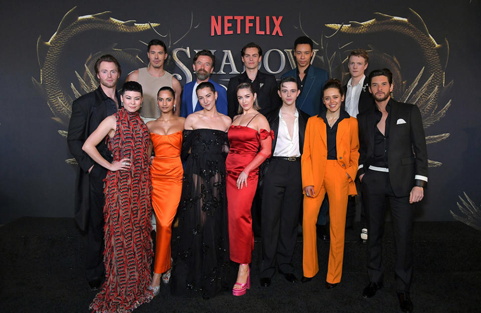 (L-R, Back to Front) Lewis Tan, Dean Lennox Kelly, Freddy Carter, Kit Young, Patrick Gibson, Calahan Skogman, Anna Leong Brophy, Amita Suman, Jessie Mei Li, Danielle Galligan, Jack Wolfe, Daisy Head and Ben Barnes attend Netflix's Shadow & Bone Season 2 Premiere at Netflix Tudum Theater on March 09, 2023 in Los Angeles, California.