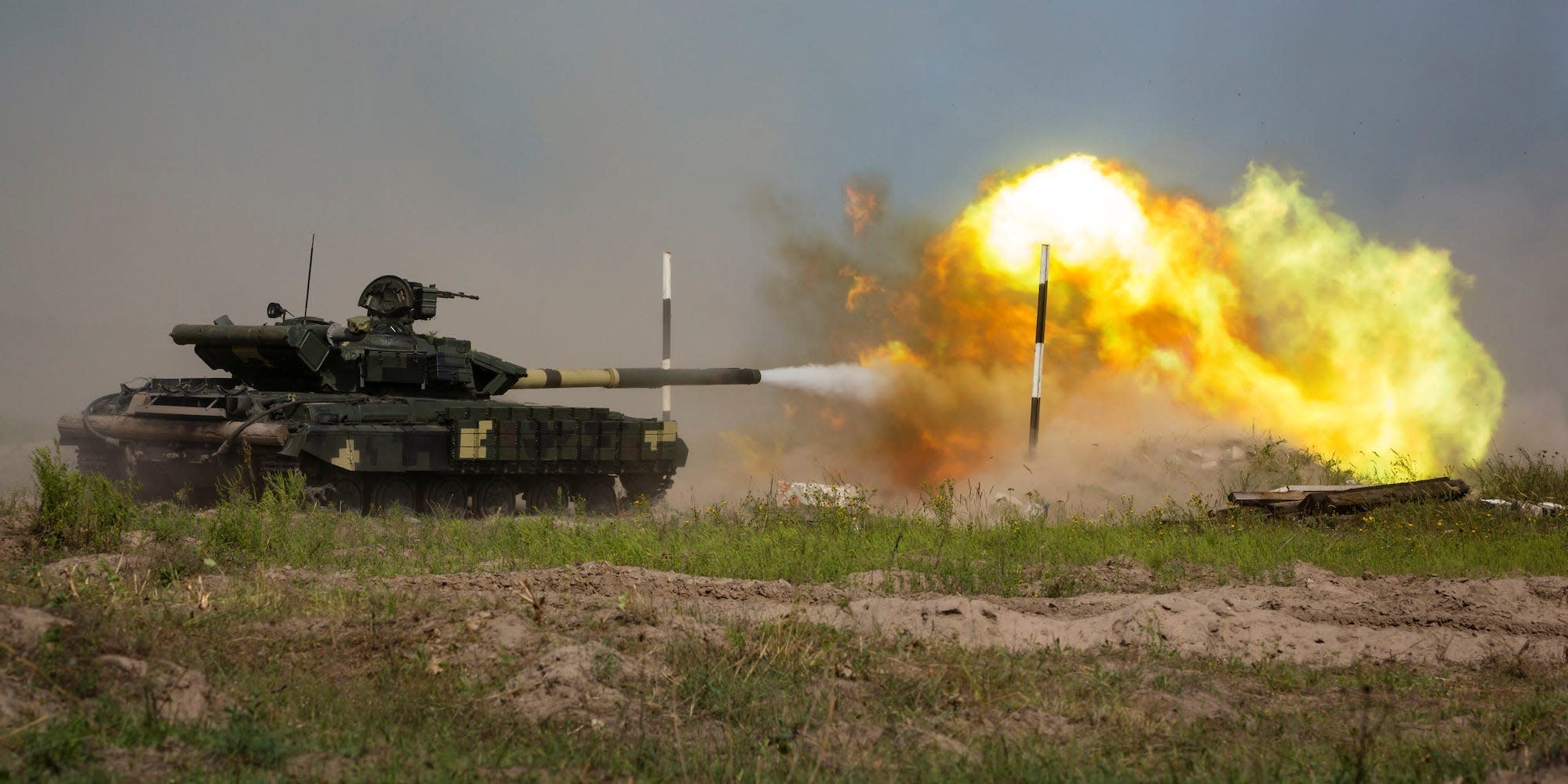 A Ukrainian T-62 tank fires during a military tactical exercise at a shooting range in Kharkiv region, Ukraine