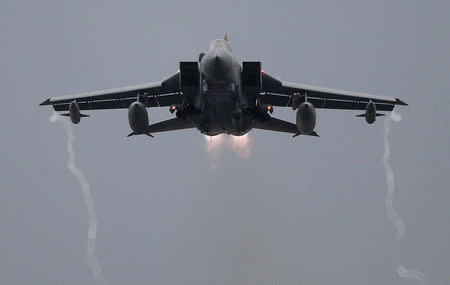 FILE PHOTO: A Royal Air Force Tornado takes off from RAF Lossiemouth in Scotland, December 2, 2015. REUTERS/Russell Cheyne/File Photo