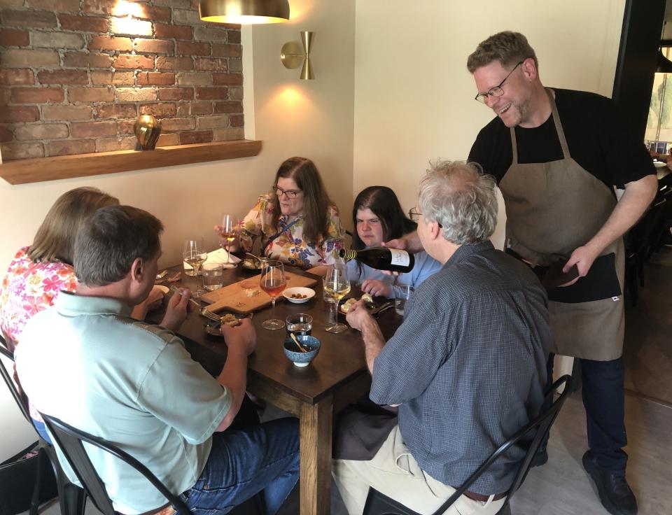 Pintxo Wine Bar owner Julian Plyter pitches in on the service end on opening night of his new Canandaigua tapas and wine bar.