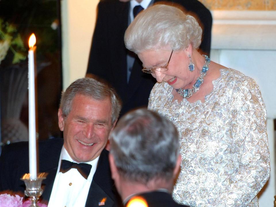 President George W. Bush laughs at Queen Elizabeth's toast