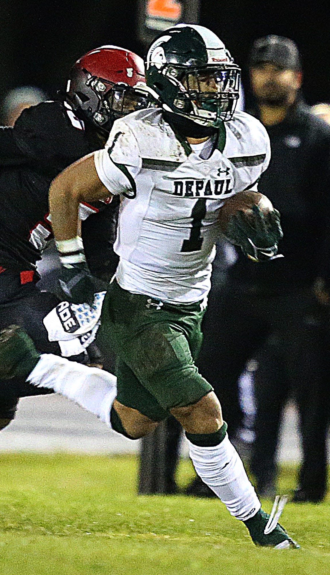 DePaul's Nolan James runs against St. Thomas Aquinas in the Non-Public B football semifinal on Nov. 10, 2023