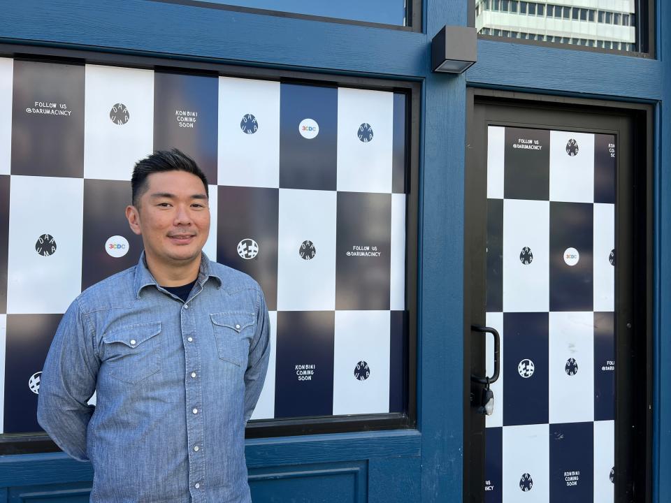 Owner Hideki Harada stands in front of the storefront for Daruma, a new Japanese convenience store located on Court Street.
