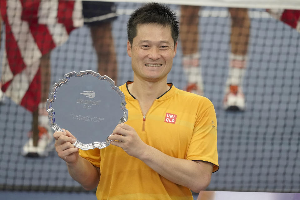 Shingo Kunieda, of Japan, holds up the runner-up trophy after losing to Alfie Hewett, of Britain, during the men's wheelchair singles final of the U.S. Open tennis championships, Sunday, Sept. 11, 2022, in New York. (AP Photo/Mary Altaffer)