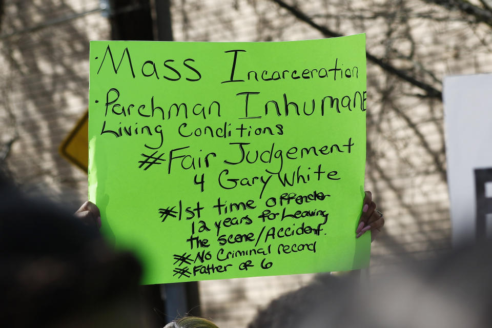 Several protest attendees wave personalized posters calling attention to specific prisoners at the Mississippi State Penitentiary in Parchman, during a mass rally in front of the Mississippi Capitol in Jackson, on Friday, Jan. 24, 2020, to protest conditions in prisons where inmates have been killed in violent clashes in recent weeks. Mississippi's new governor says he and the interim corrections commissioner toured a troubled state prison to see conditions and to try to understand what led to an outburst of deadly violence in recent weeks. (AP Photo/Rogelio V. Solis)