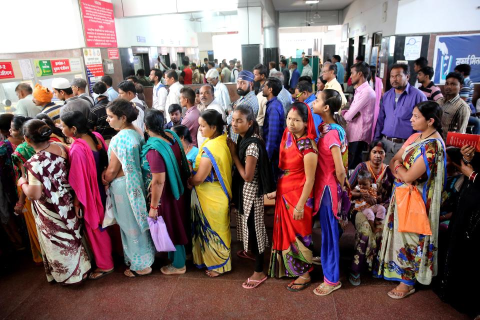 Patients queue up to register for treatment at Government Jai Prakash hospital following a dengue outbreak.