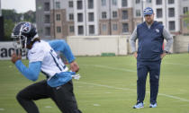 Titans general manager Jon Robinson watches wide receiver Josh Reynolds (18) during an NFL football practice Thursday, June 10, 2021, in Nashville, Tenn. (George Walker IV/Pool Photo via AP)