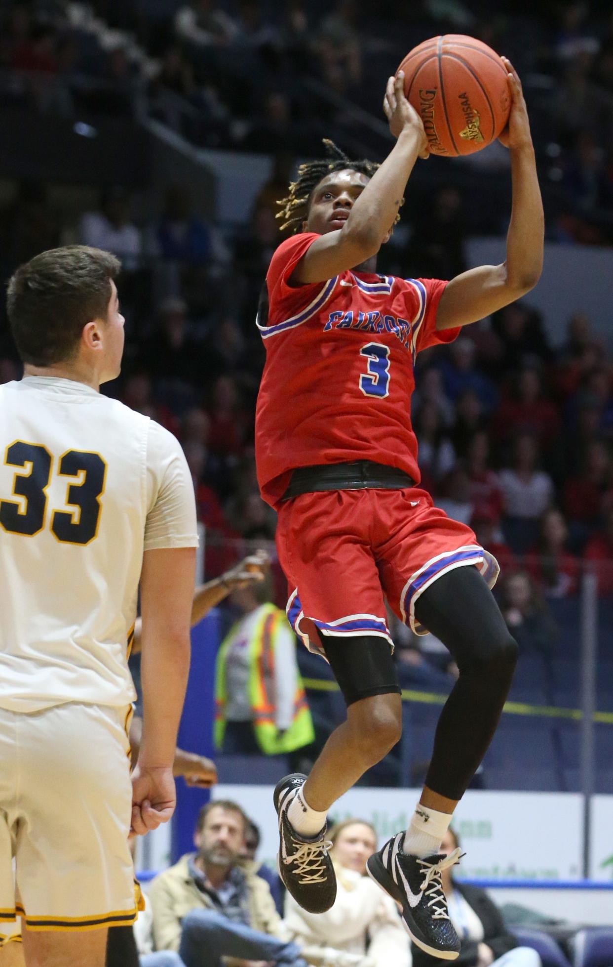 Fairport's LaShard Lowery drives to the basket around Victor's Nick Leonard during their Class AA Championship final Saturday, March 4, 2023 a the Blue Cross Arena.