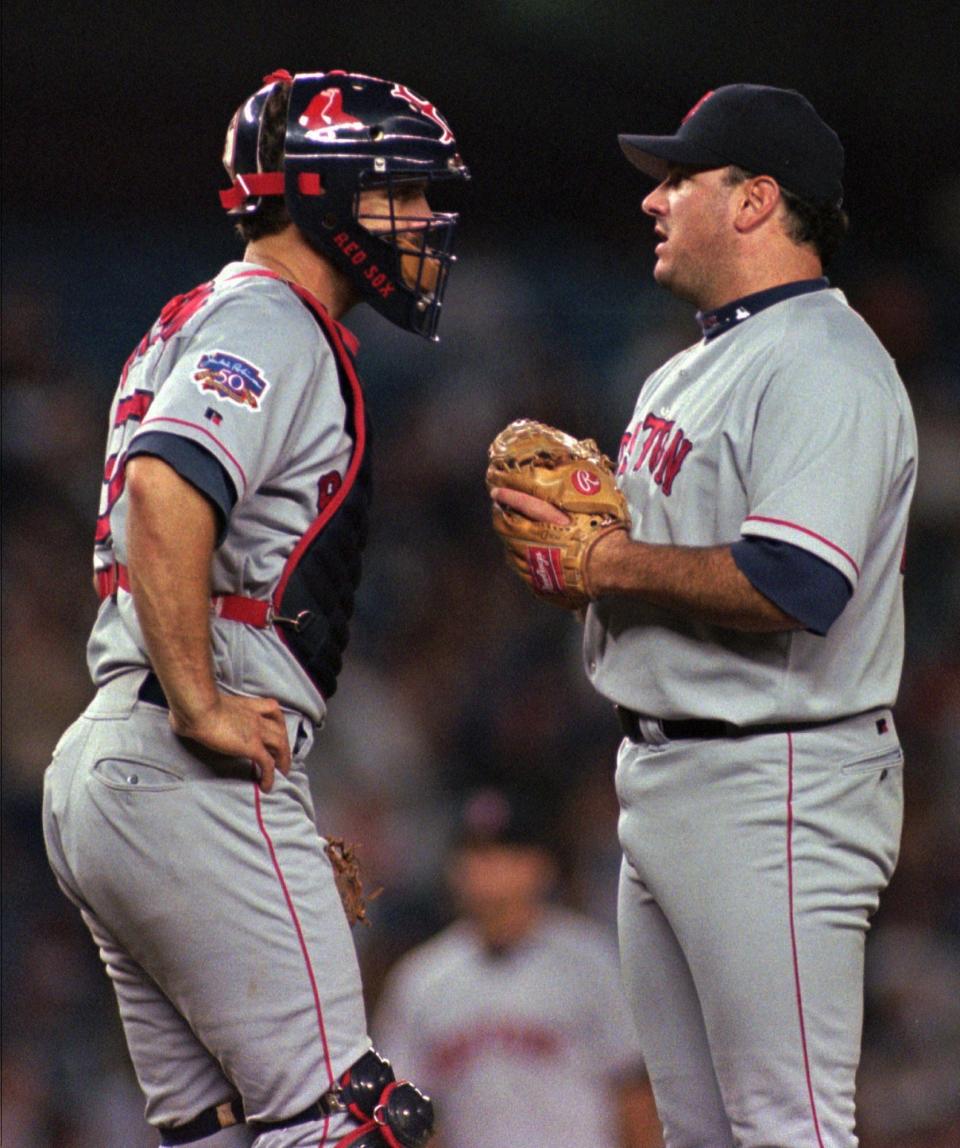 Boston Red Sox pitcher Jim Corsi, right, and catcher Bill Haselman talk during a 1997 game.