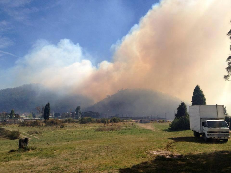 In this photo provided by the New South Wales Rural Fire Service, smoke rises from a fire near Lithgow, west of Sydney, Thursday, Oct. 17, 2013. (AP Photo/New South Wales Rural Fire Service)