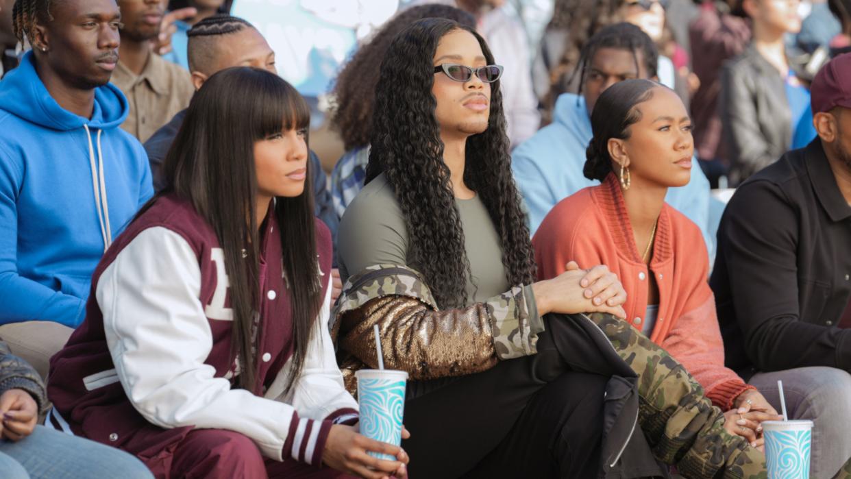  Geffri Maya as Simone Hicks, Rhoyle Ivy King as Nathaniel Hardin and Netta Walker as Keisha McCalla watching a game in All American: Homecoming season 3. 