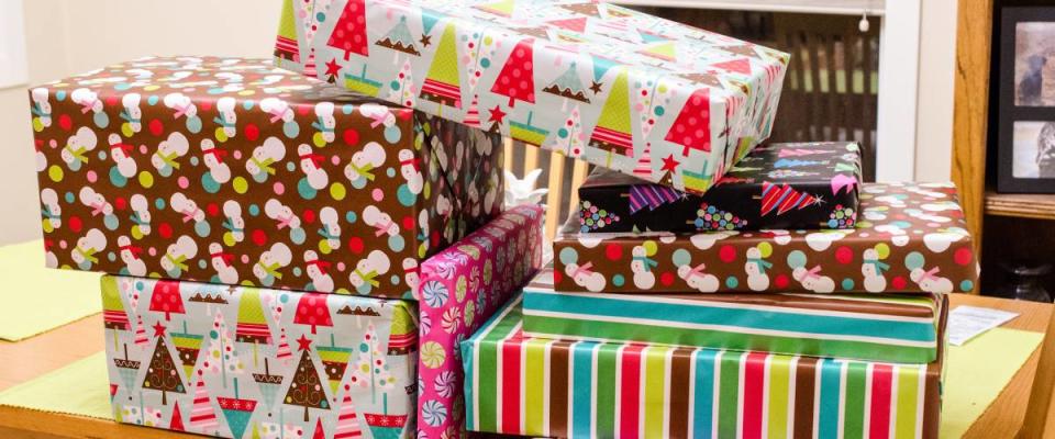 Stack of boxes wrapped in different Christmas wrapping paper