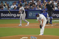 Arizona Diamondbacks' Gabriel Moreno, left, tosses his bat after hitting a three-run home run as Los Angeles Dodgers starting pitcher Clayton Kershaw looks on during the first inning in Game 1 of a baseball NL Division Series Saturday, Oct. 7, 2023, in Los Angeles. (AP Photo/Mark J. Terrill)