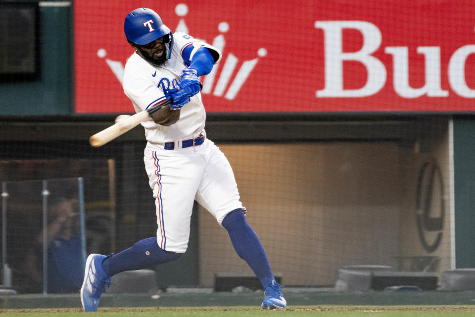 Texas Rangers right fielder Adolis Garcia (53) makes contact with a pitch in the bottom of the eighth inning in a baseball game against the Detroit Tigers in Arlington, Texas, Thursday, June 29, 2023. (AP Photo/Emil T. Lippe)