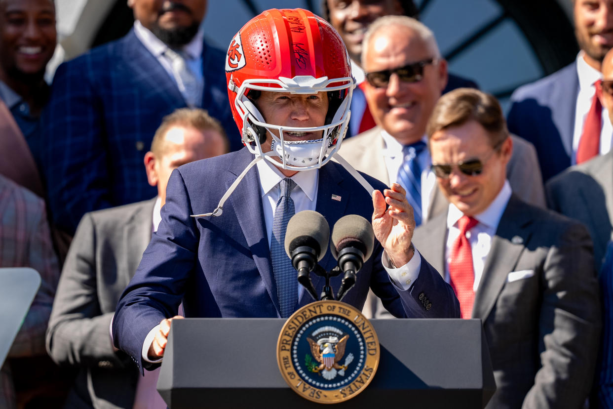 WASHINGTON, DC - MAY 31: U.S. President Joe Biden wears a football helmet presented to him by the NFL Super Bowl champion Kansas City Chiefs as he speaks on the South Lawn of the White House on May 31, 2024 in Washington, DC. President Biden hosted the Chiefs to honor their 2024 Super Bowl win. (Photo by Andrew Harnik/Getty Images)