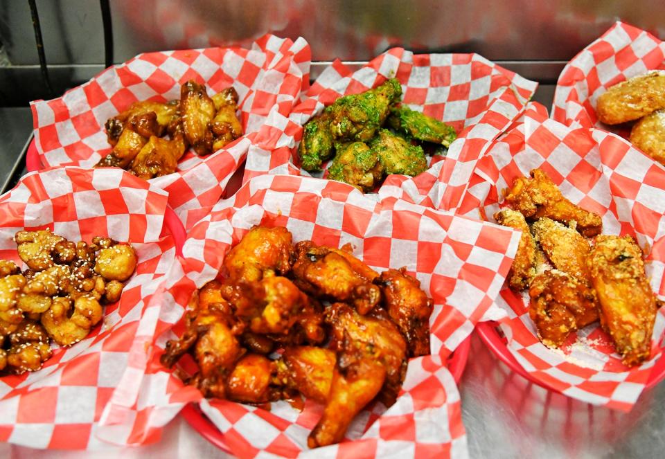 Willingboro native Timothy Witcher prepares a variety of chicken wing orders such as honey jalapeño, garlic parmesan and sesame ginger at The Wing Kitchen, which has a popular food truck and other locations in the area at local stadiums. Witcher shut down his brick-and-mortar eateries in Glassboro and Turnersville.