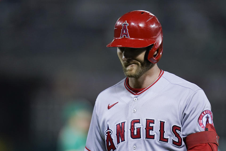 Los Angeles Angels' Taylor Ward walks back to the dugout after grounding out against the Oakland Athletics during the sixth inning of a baseball game in Oakland, Calif., Tuesday, Oct. 4, 2022. (AP Photo/Godofredo A. Vásquez)