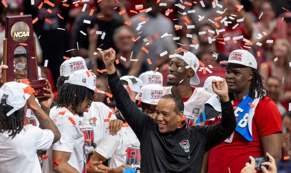 N.C. State coach Kevin Keatts and his players accept the NCAA South Regional Championship trophy in a shower of confetti following the Wolfpack’s 76-64 victory over Duke on Sunday, March 31, 2024 at the American Airlines Center in Dallas, Texas.