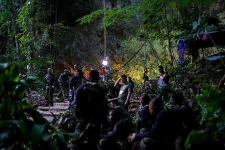 Military personnel gather as they prepare to go in to Tham Luang cave complex, as members of an under-16 soccer team and their coach have been found alive according to local media in the northern province of Chiang Rai, Thailand, July 5, 2018. REUTERS/Athit Perawongmetha