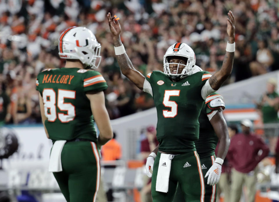 Miami quarterback N'Kosi Perry (5) encourages the crowd to cheer during the second half of an NCAA college football game against Florida State, Saturday, Oct. 6, 2018, in Miami Gardens, Fla. Miami won 28-27. (AP Photo/Lynne Sladky)